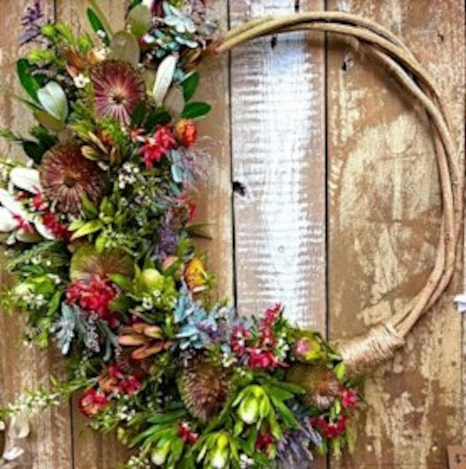 Beautiful native flower wreath on a timber table