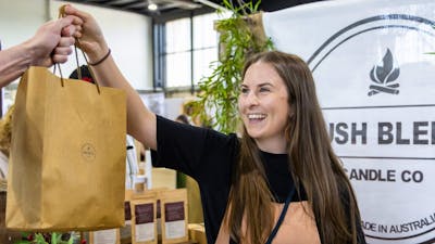Bush Blend Candle Co handing bag to a customer