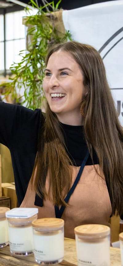 Bush Blend Candle Co handing bag to a customer