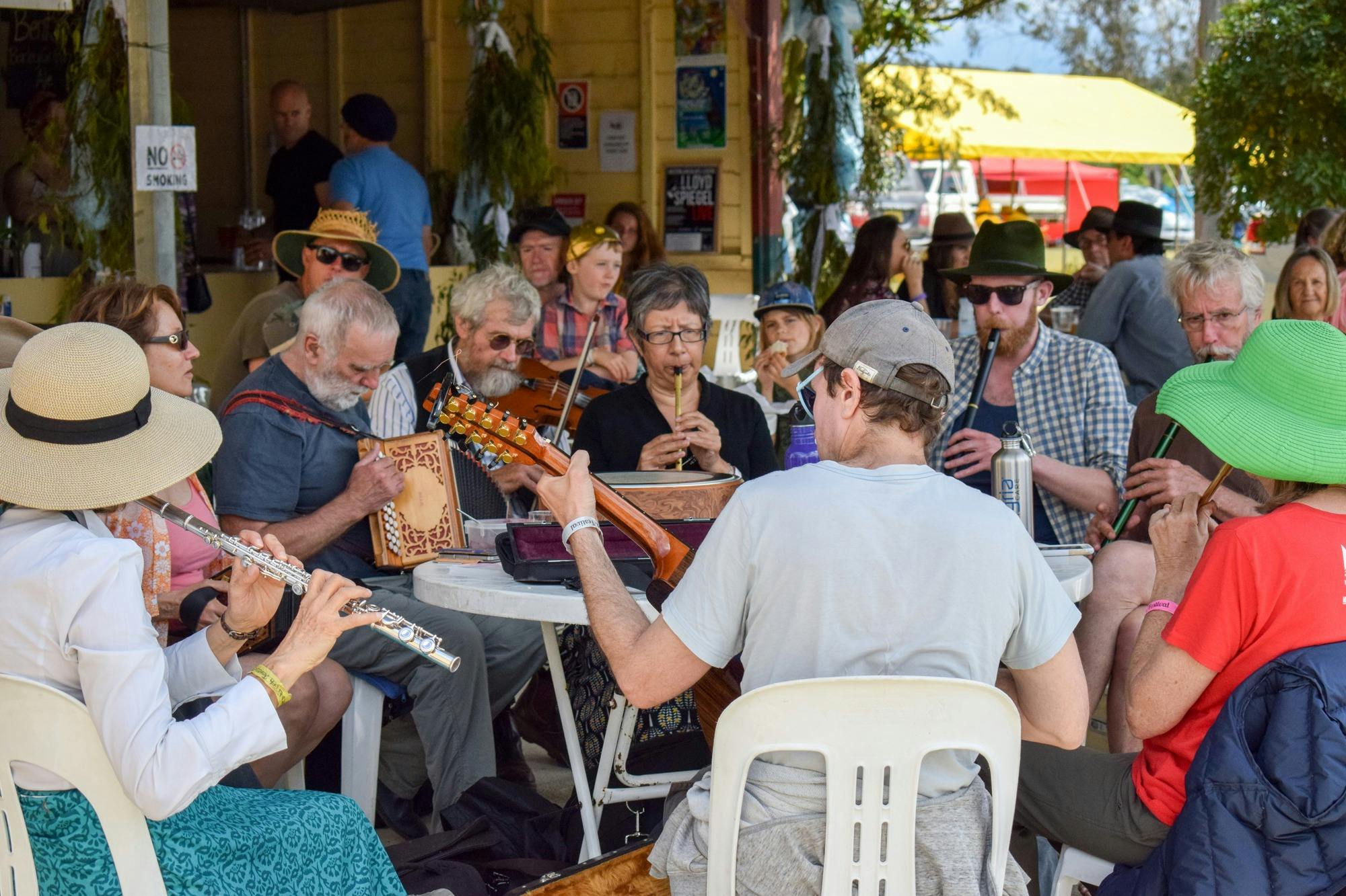 Group of musicians playing around a table