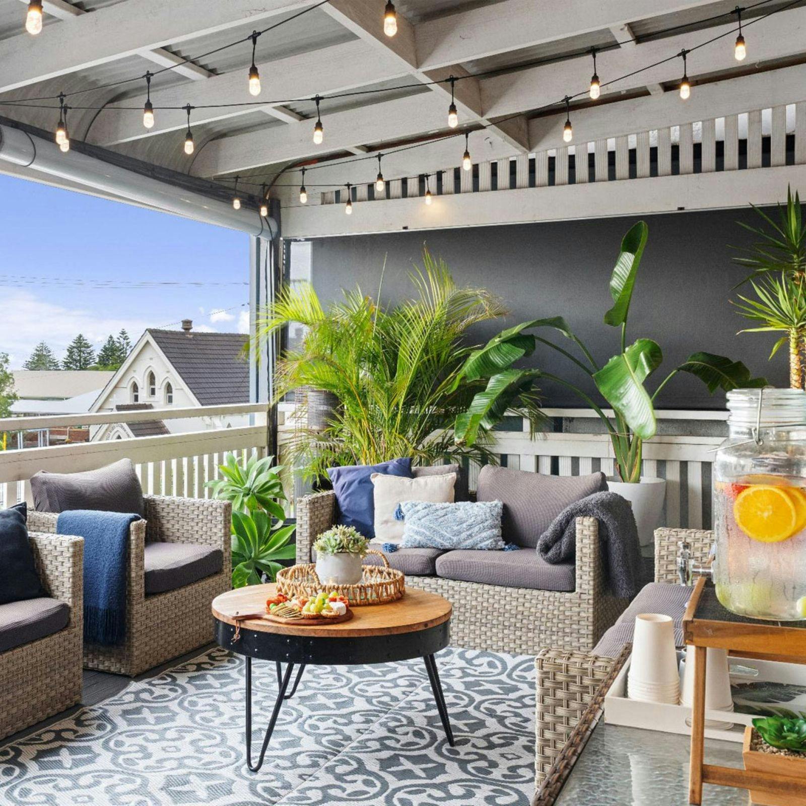 Arabella Balcondy with comfortable wicker lounges and coffee table with tea