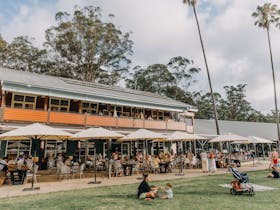 Parkside cafe with undercover outdoor seating. Events space upstairs verandah overlooking park