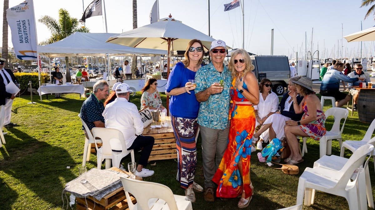 A group of friends drinking on the lawns of Royal Queensland Yacht Squadron