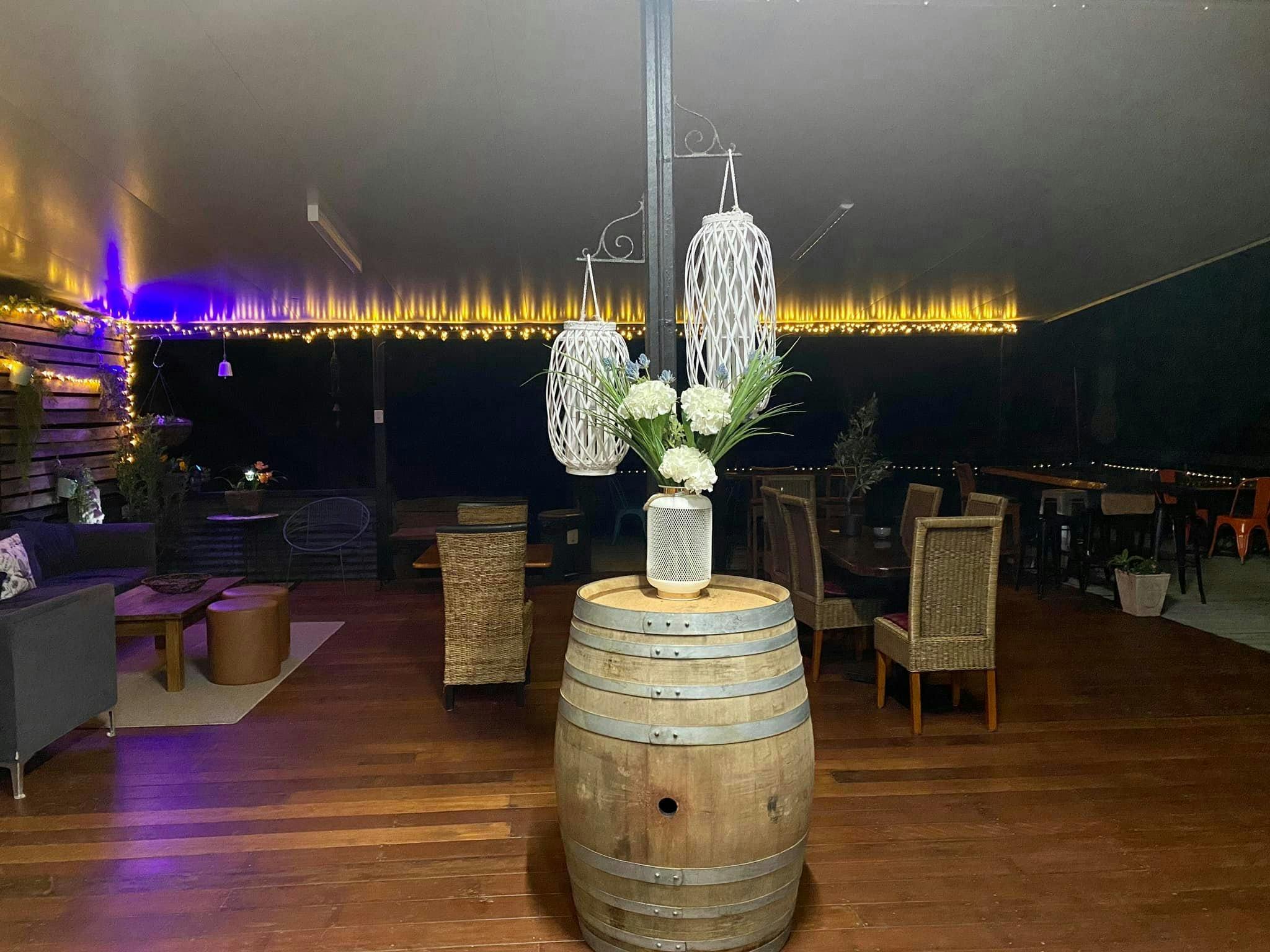 Image of outdoor area featuring wine barrels