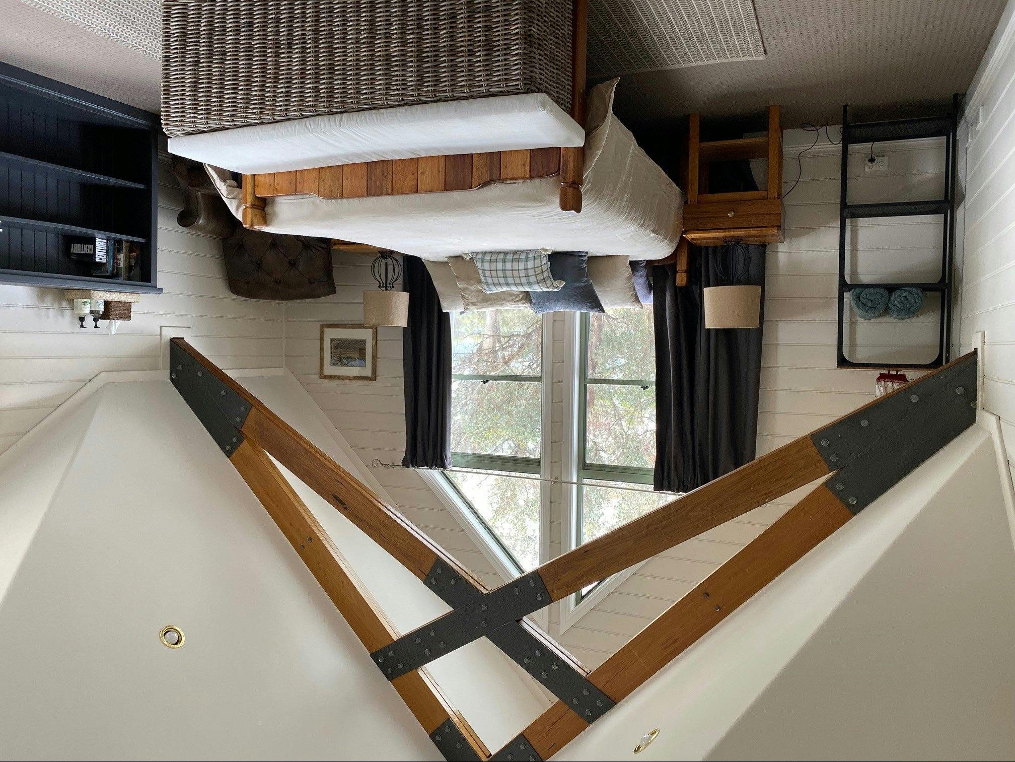 This stylish yet comfortable bedroom has a queen bed along with air-conditioning.