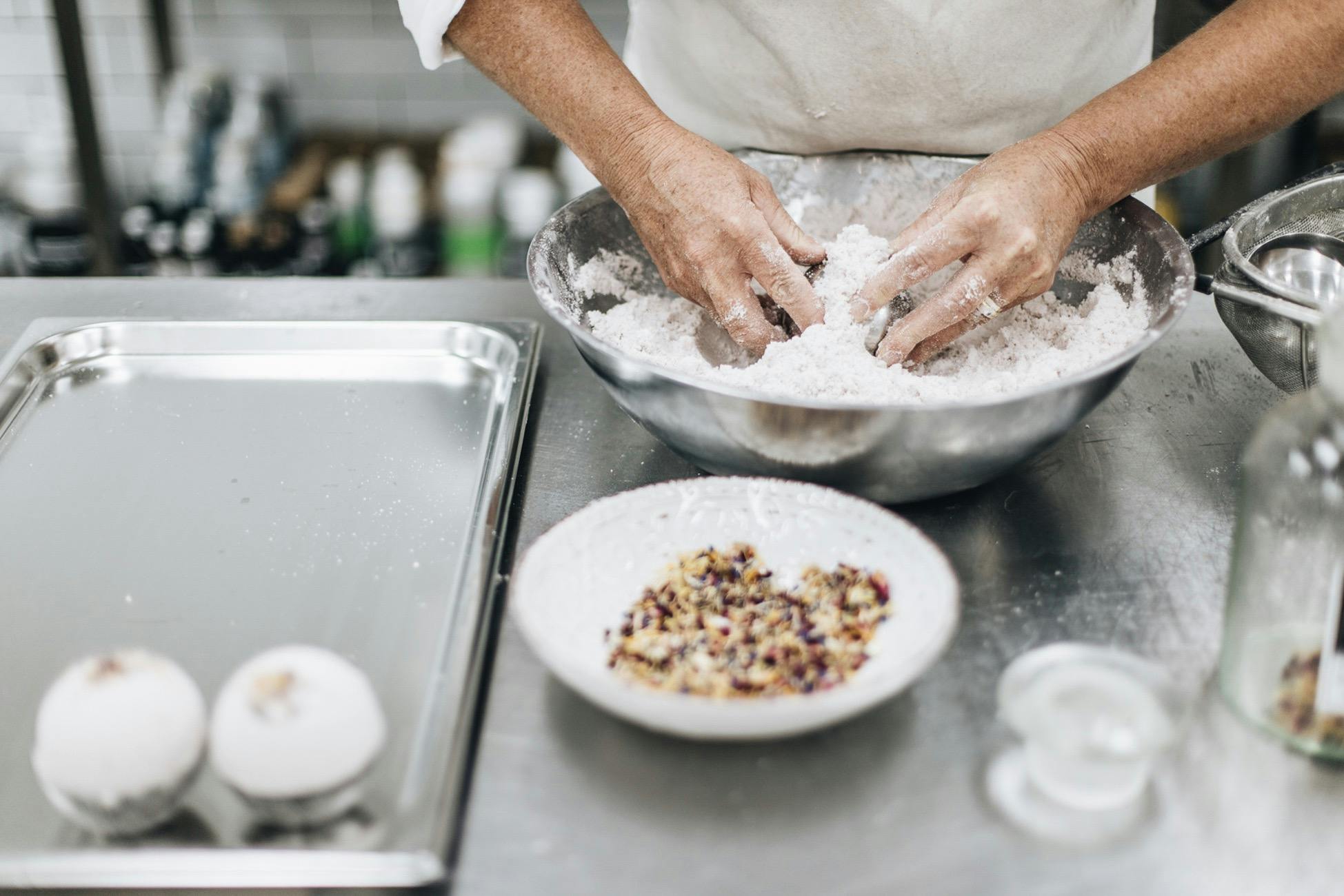 Hand making bath bombs