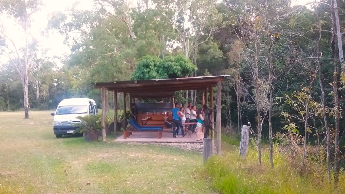 wine and beer by a creek