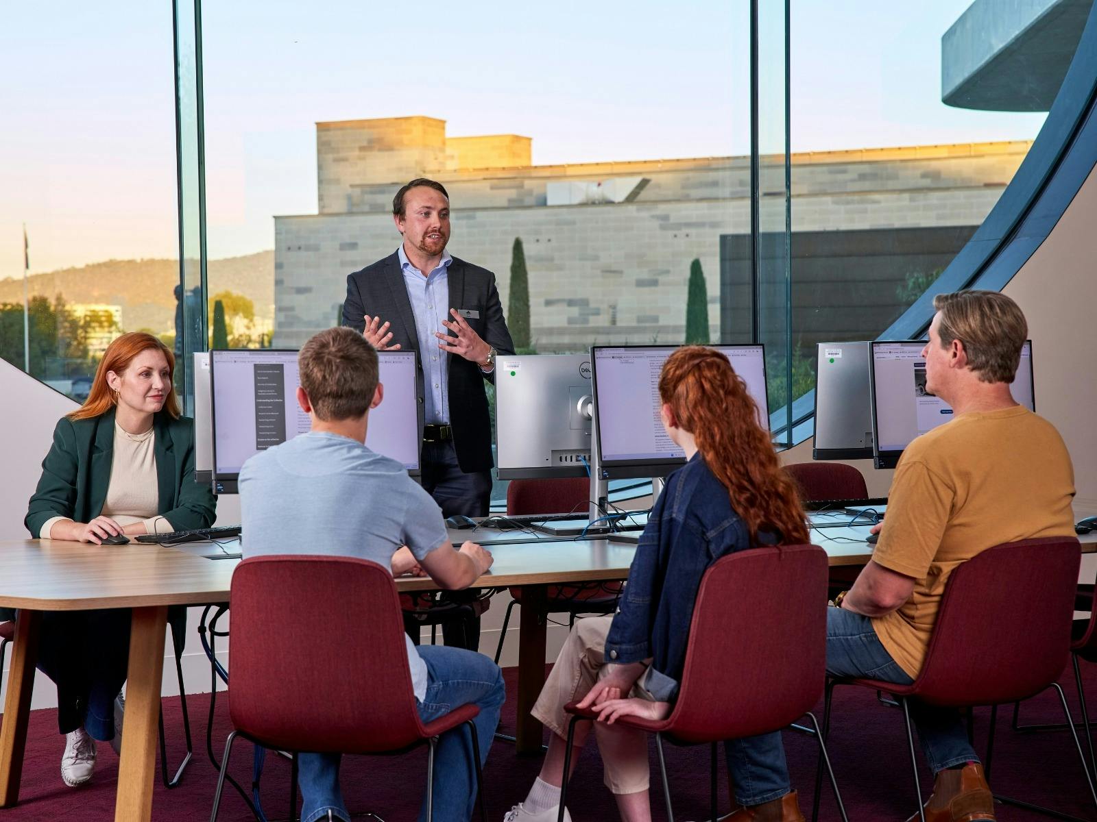 Visitors listening to a Research Officer in the Charles Bean Research Centre at the Memorial