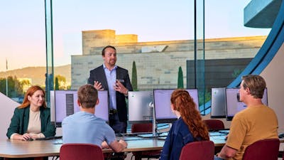 Visitors listening to a Research Officer in the Charles Bean Research Centre at the Memorial