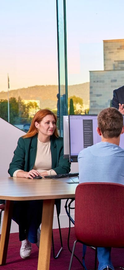 Visitors listening to a Research Officer in the Charles Bean Research Centre at the Memorial