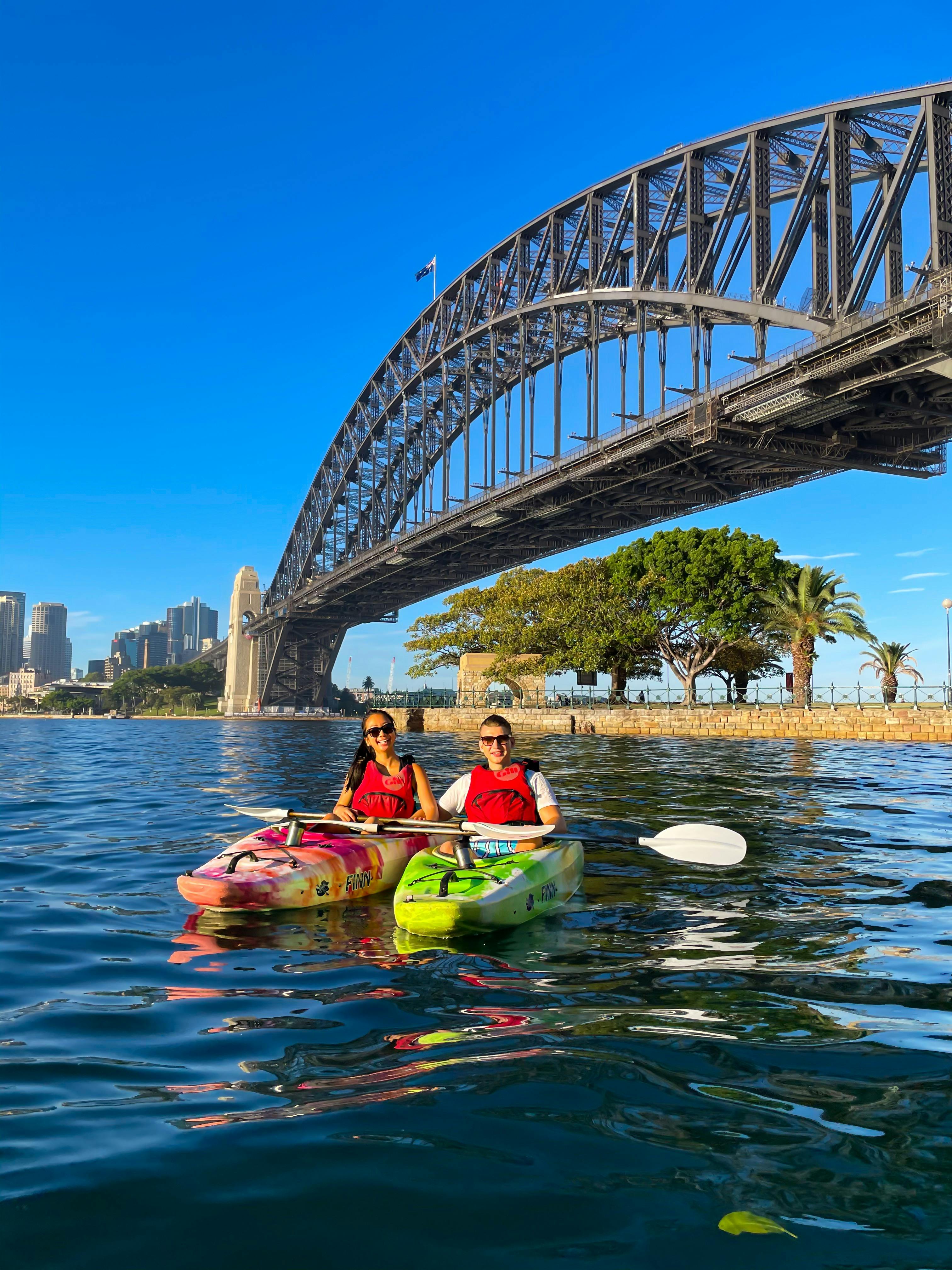 Couple of guests with Sydney By Kayak get their photos taken for free from guides.
