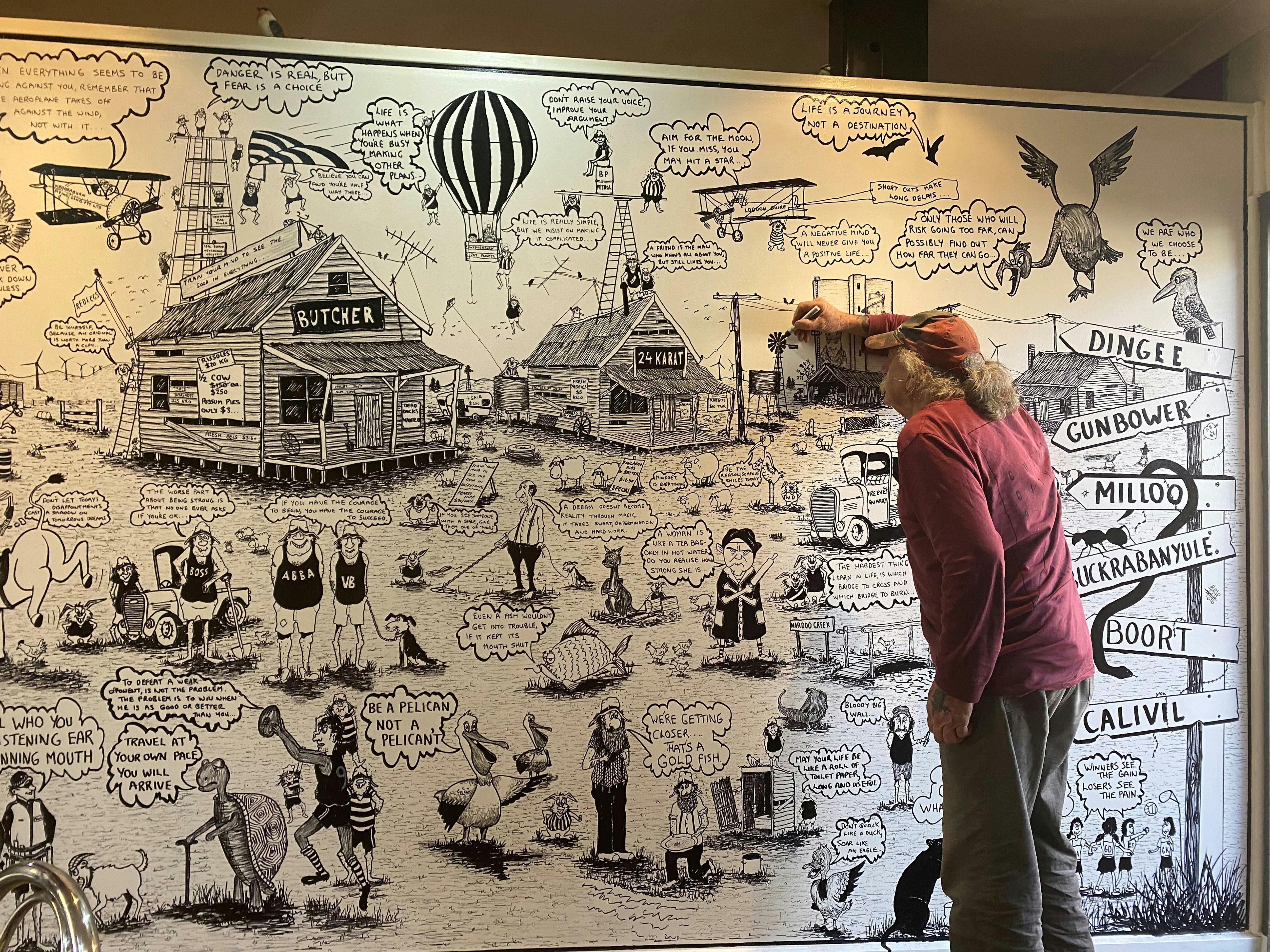 Local resident Len livening up the cafe walls.