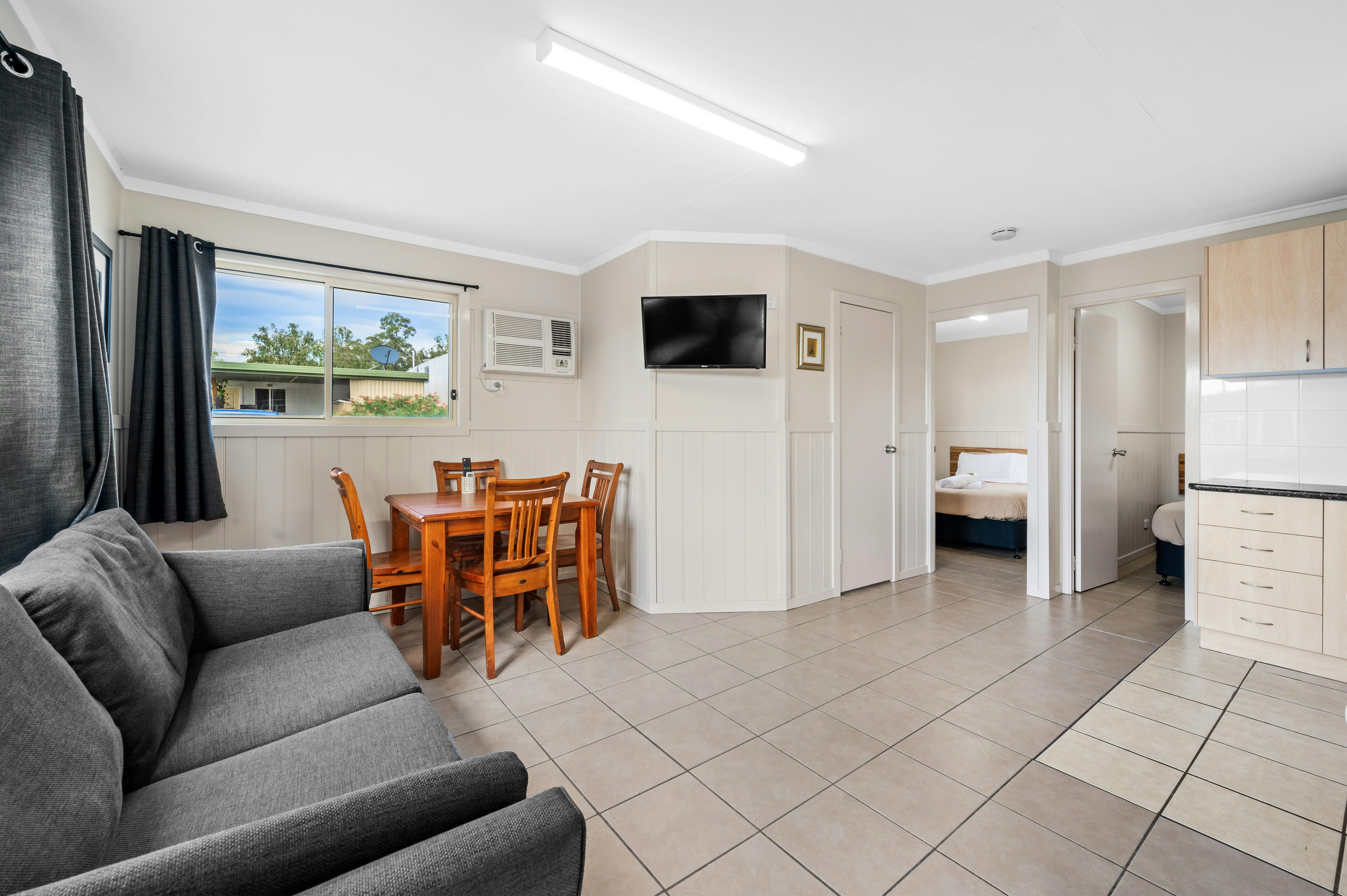 2 bedroom cabin sleeps 3-4 queen bed double bed living dining kitchen bathroom TV aircon