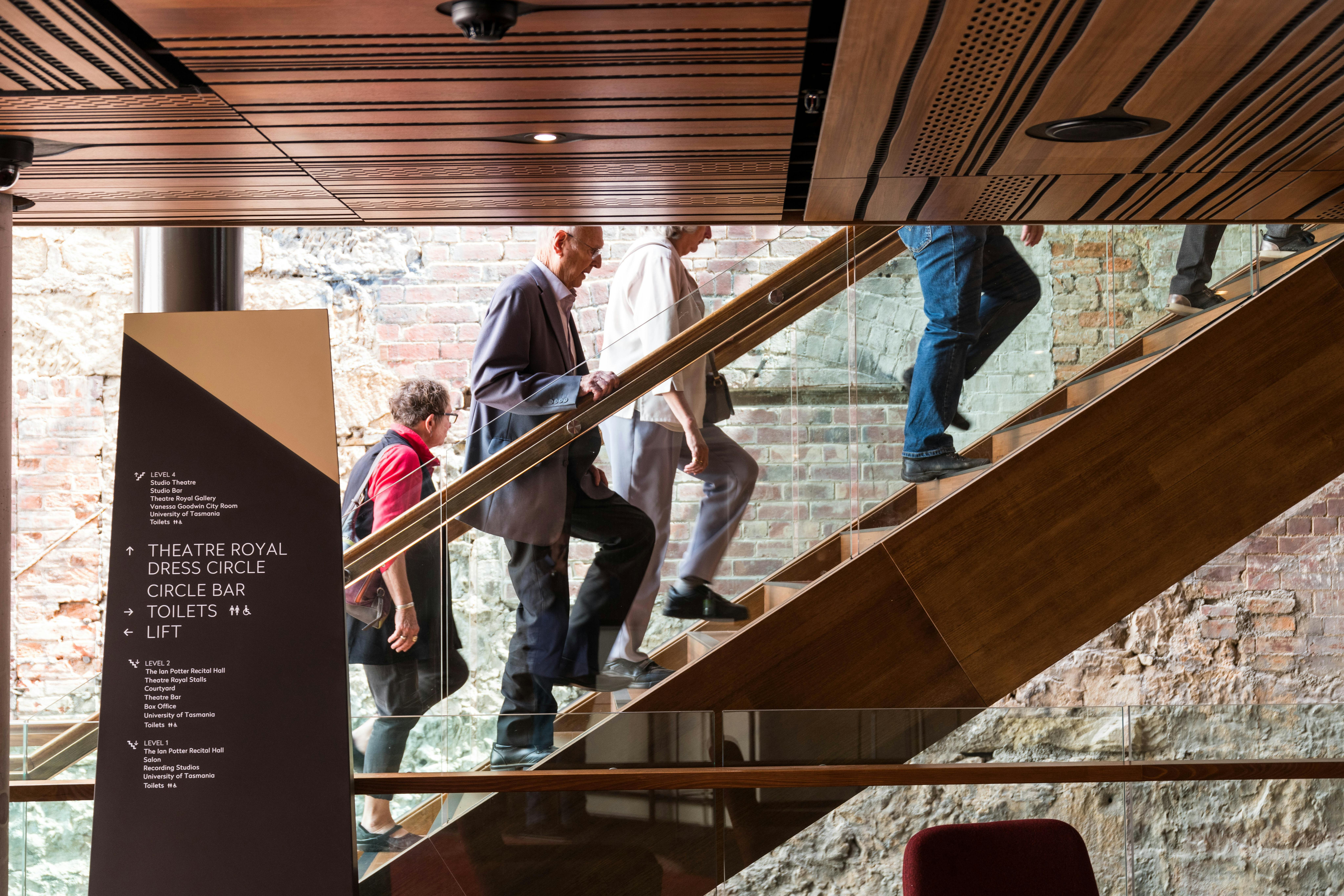Patrons walking up stairs