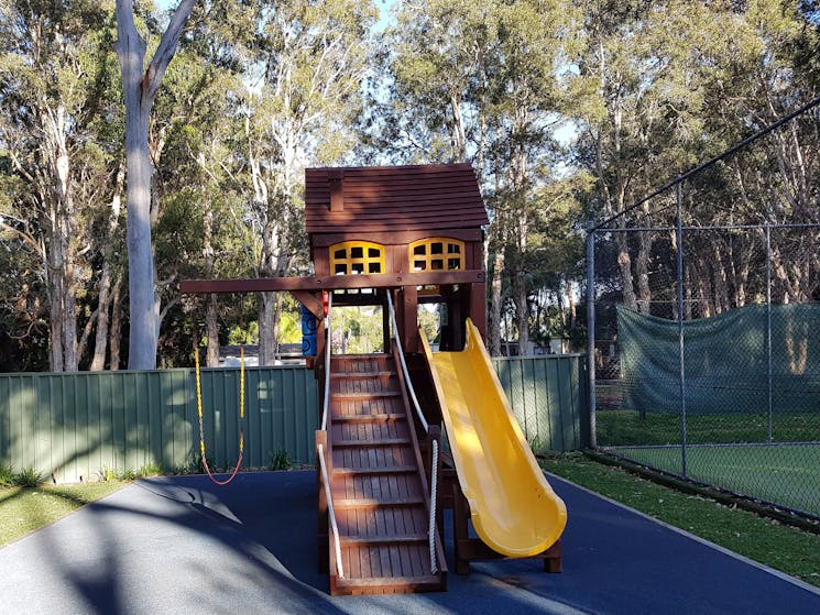 Spacious grassy area for children’s play activities, and a Timber Jungle Gym