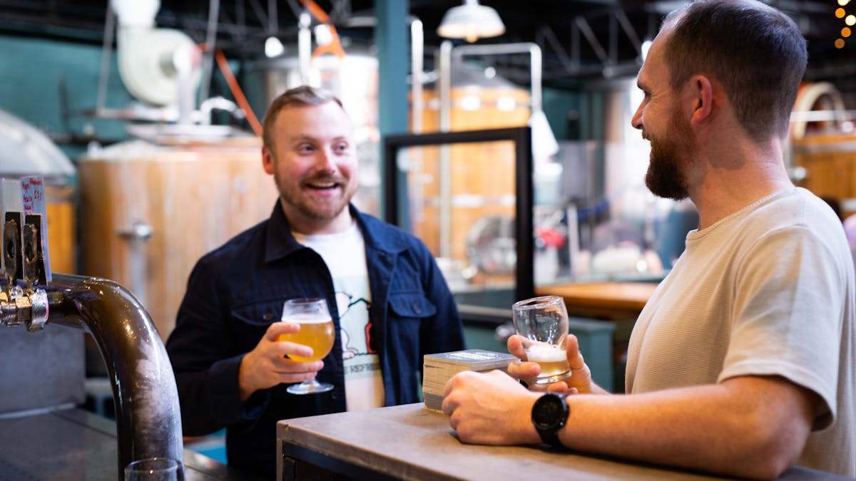 Two men smiling