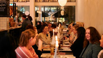 Group of people eating in Italian restaurant