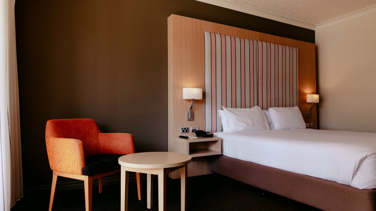 King bed room with chair seating area