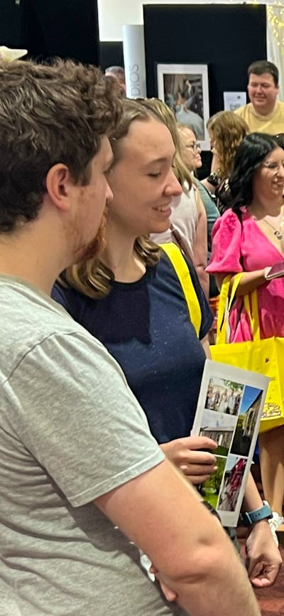 Couples talking with exhibitors at Your Local Wedding Guide Canberra Expo.