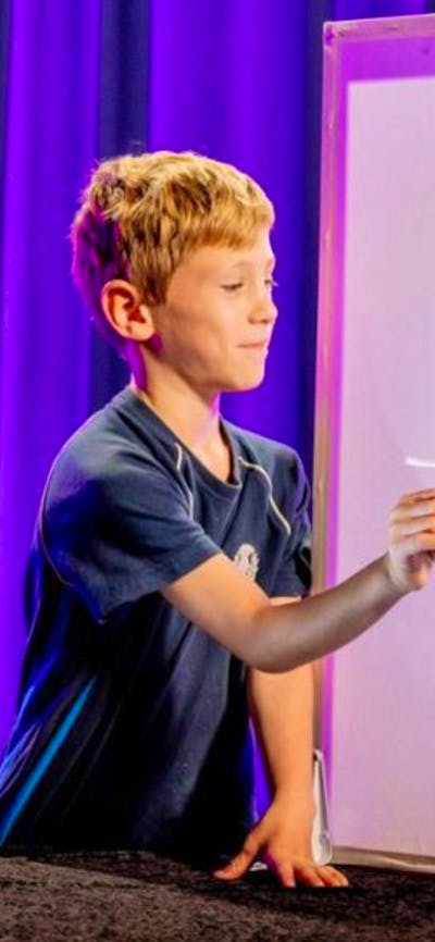 A man and a young boy exploring light in Science Time