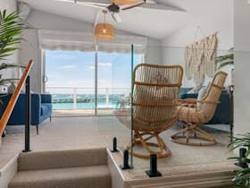 A light filled raised sitting room with stunning views in any season.  Looks out towards the jetty.