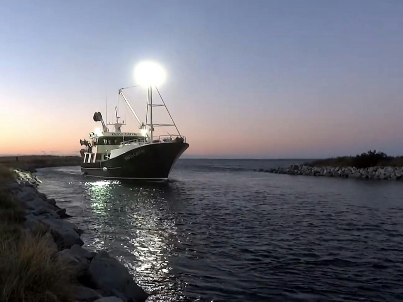 Fishing boat arriving at dock