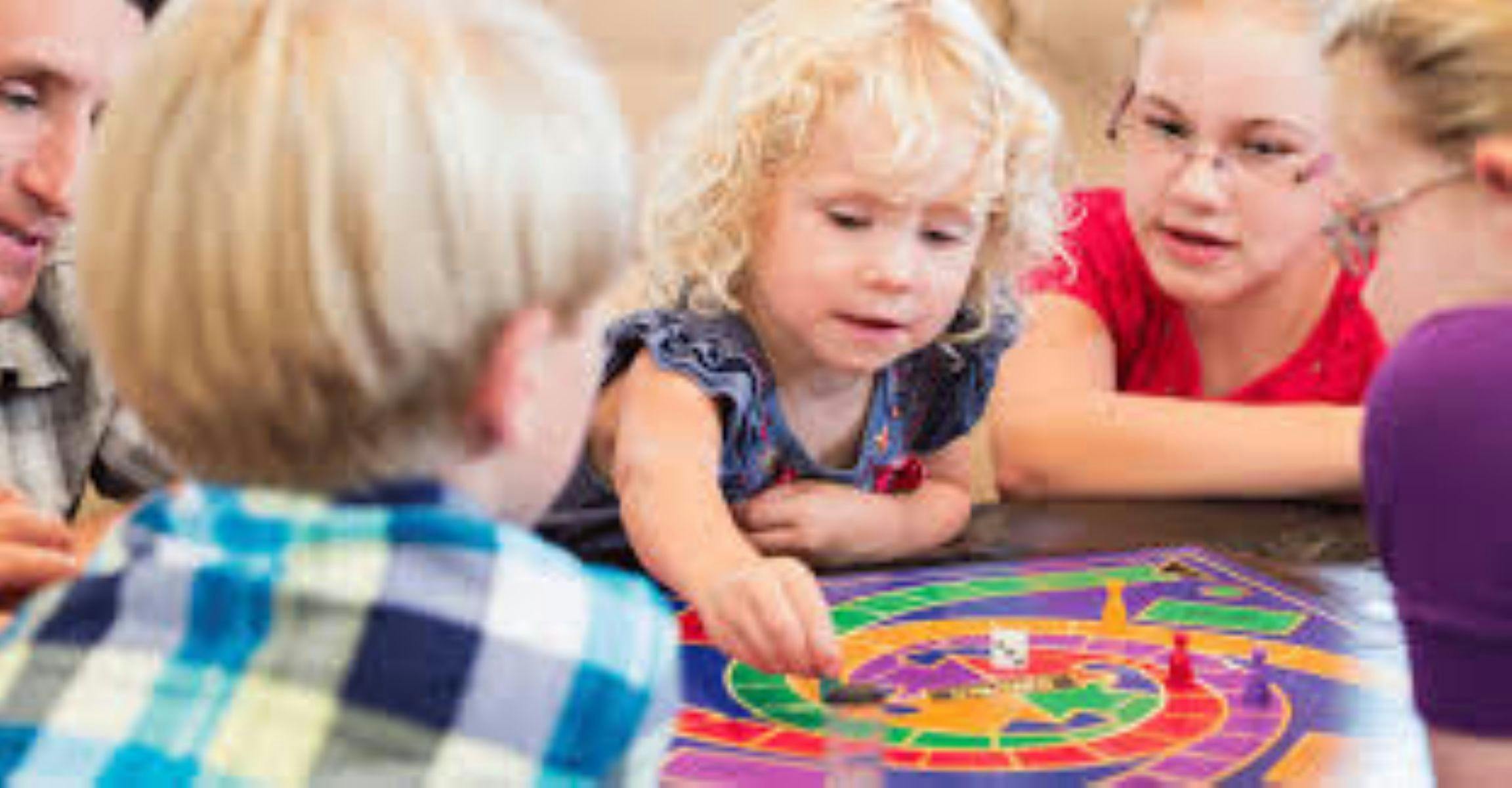 Kids playing board game
