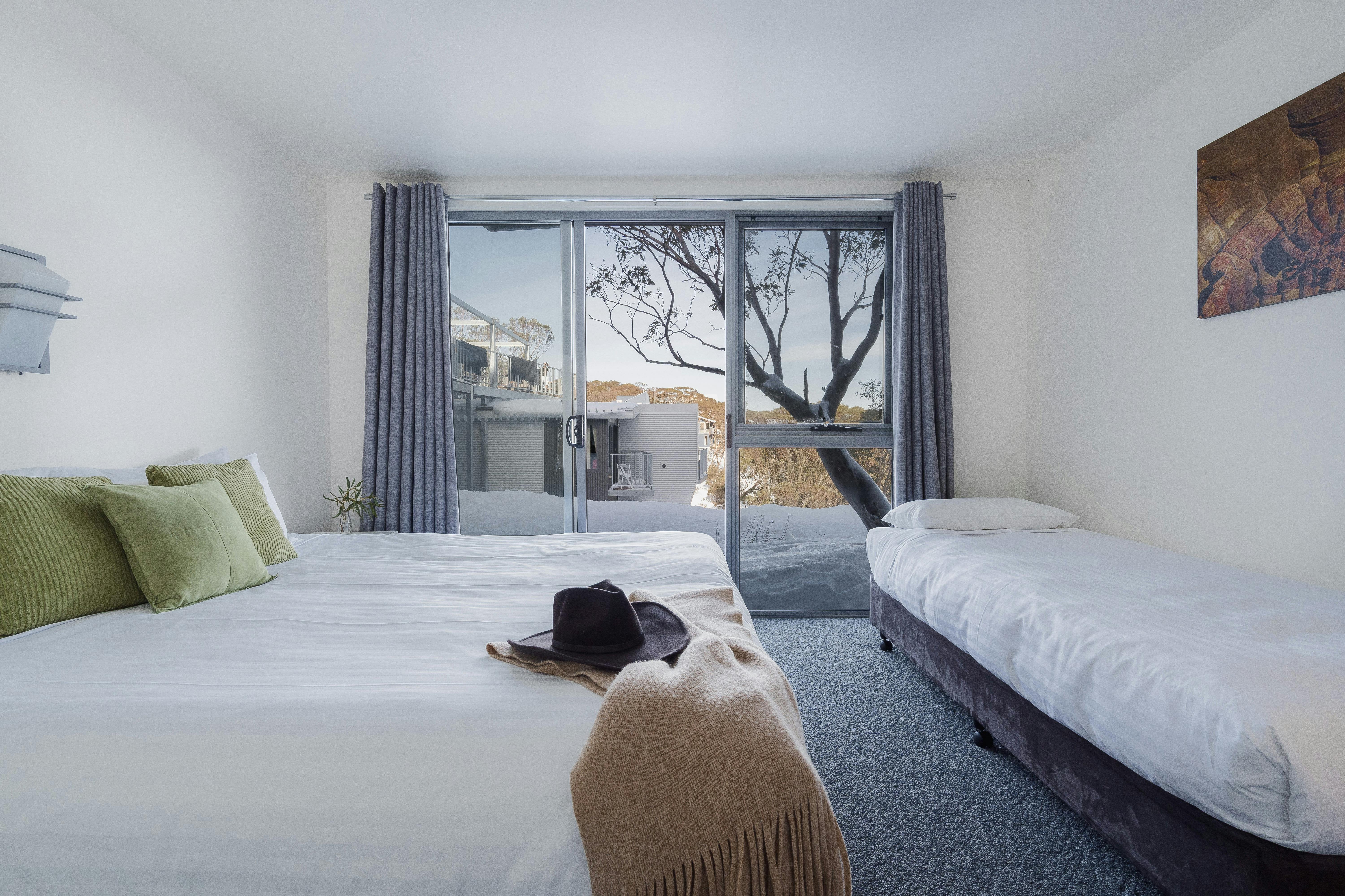 Bedroom configuration showing king bed with one single. Can be configured with 3 single beds