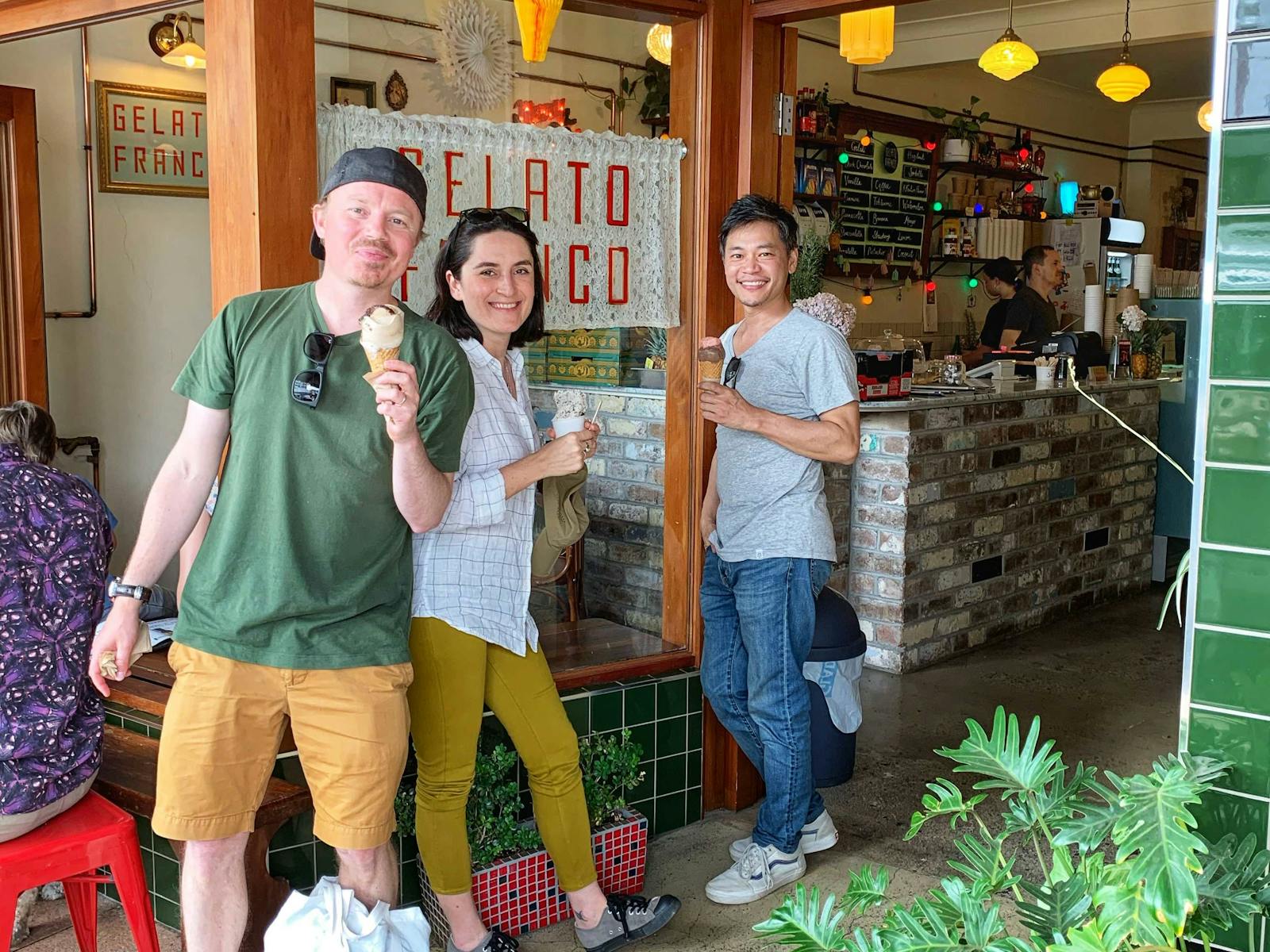 ID three guests enjoying their gelati outside the gelato shop