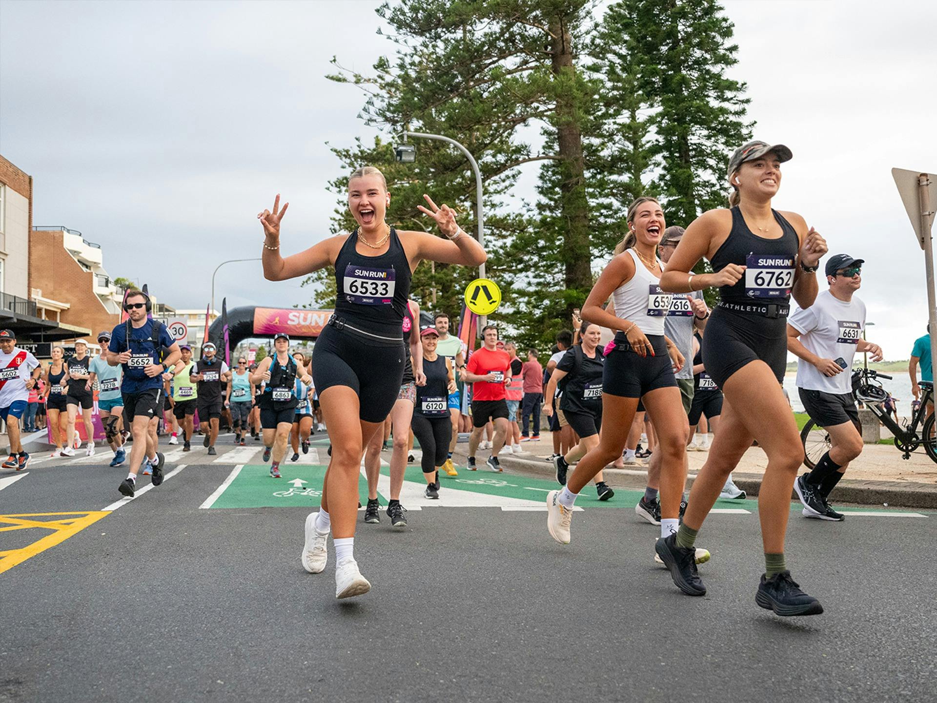 Runners smile at camera
