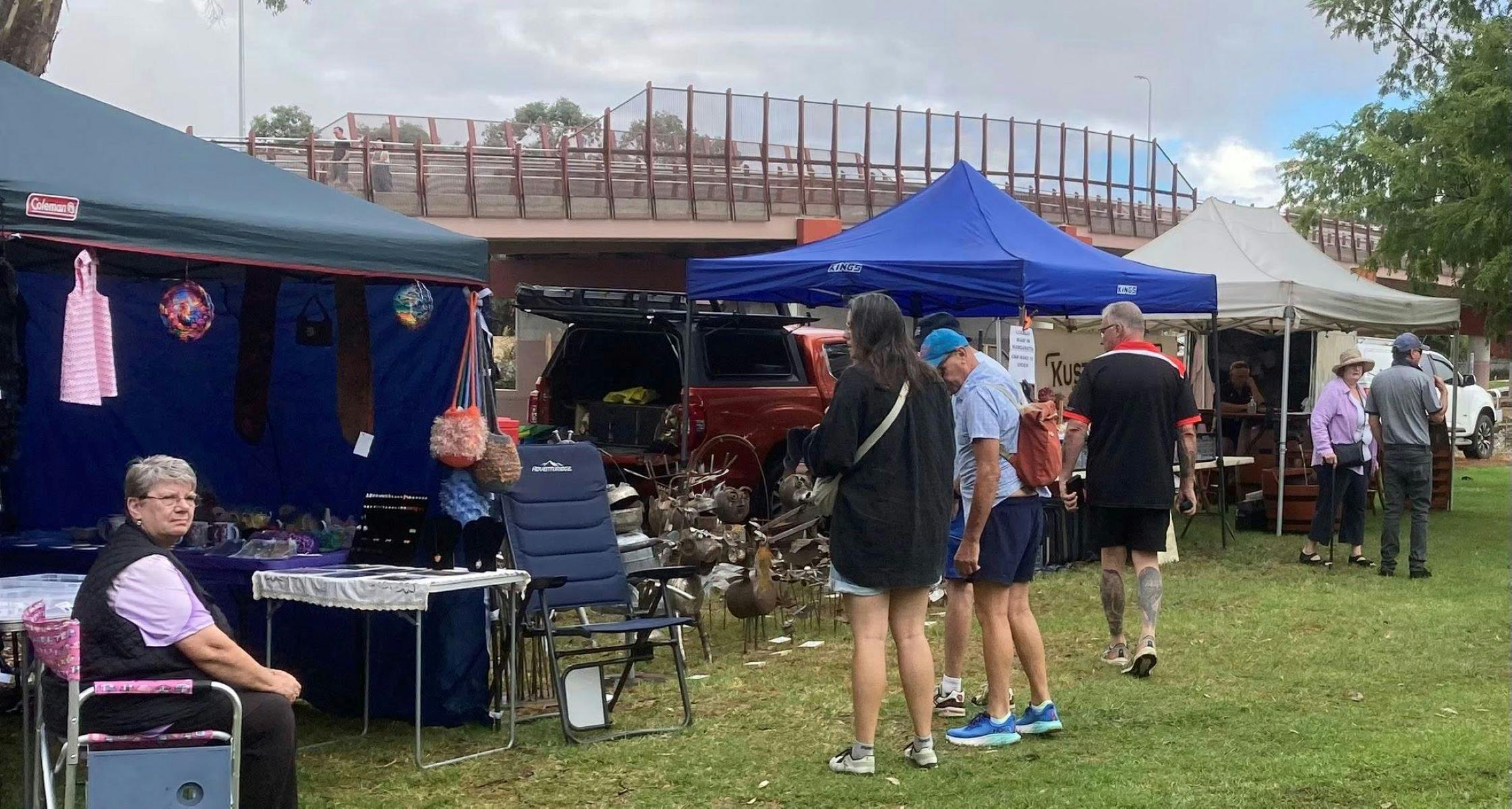 People shopping at market stalls