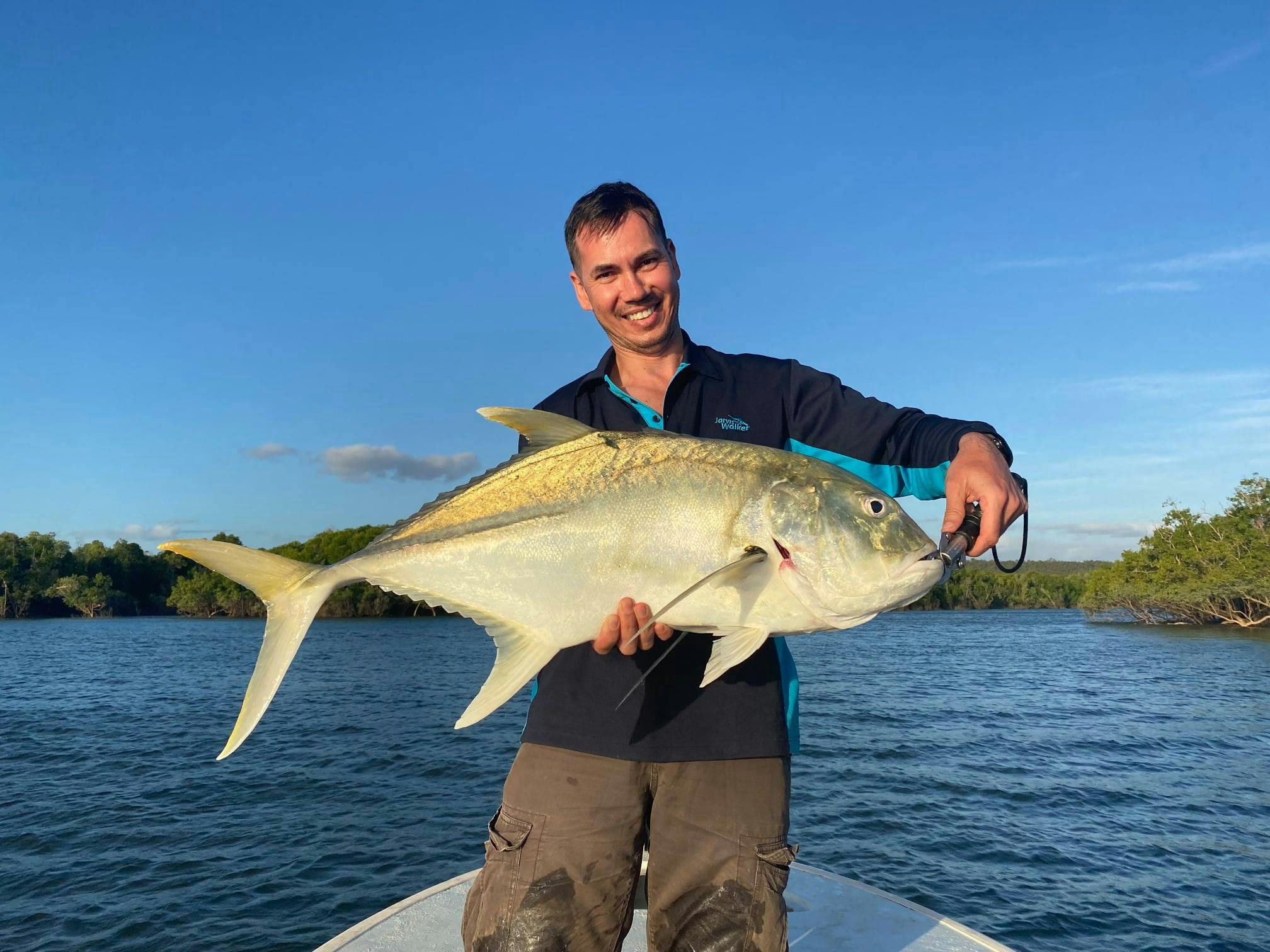 a giant Trevally catch from a skiff