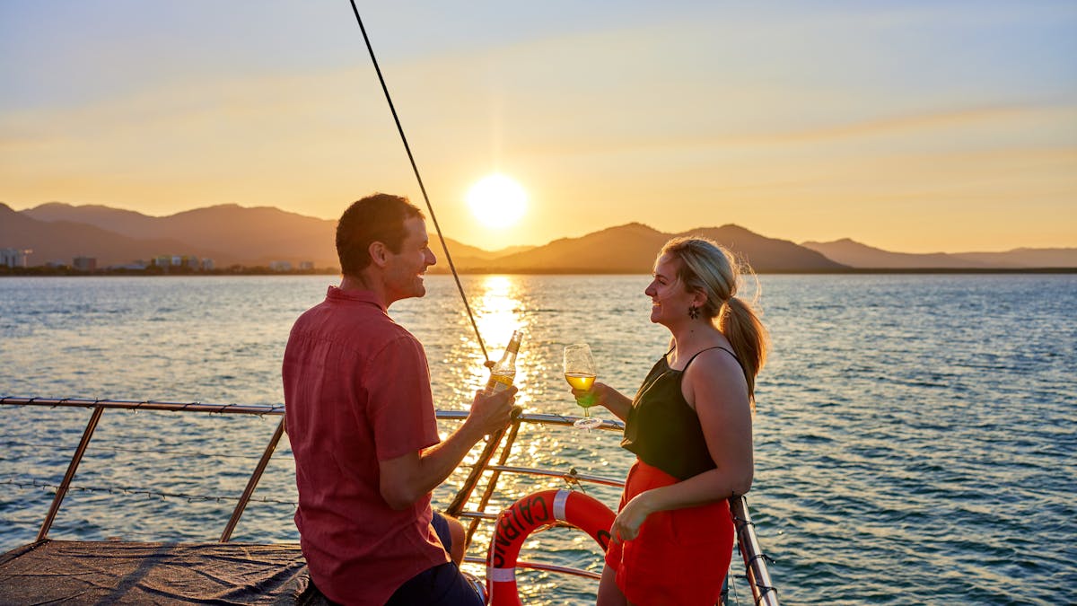 Couple cheers at Sunset