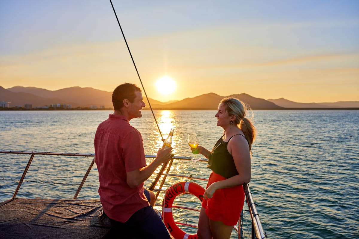 Couple cheers at Sunset