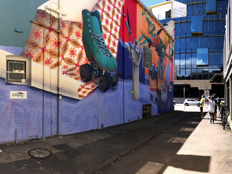 Guests enjoying one of Newcastle's large scale street art murals