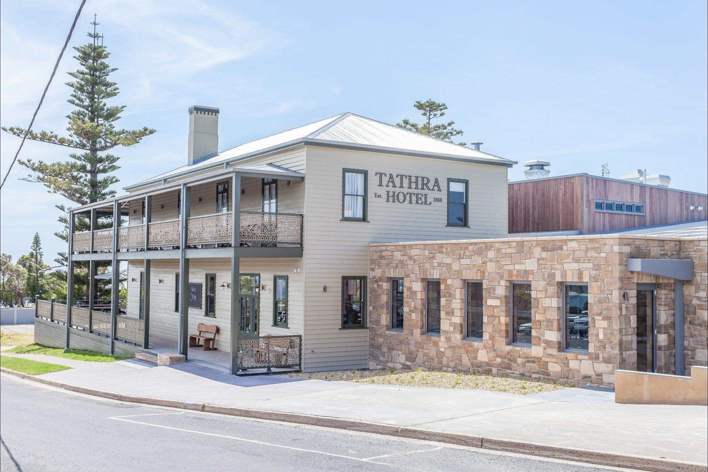 Tathra Hotel since 1888 - heritage listed building with stone wall