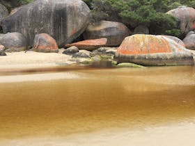 Tidal River and rugged granite boulders combine to make a serene setting at Wilsons Prom