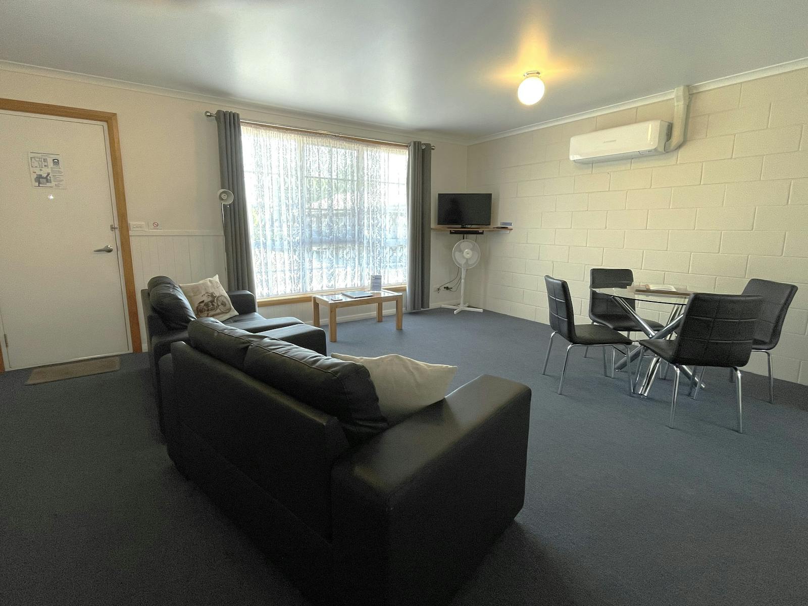 Spacious lounge and dining area with airconditioning