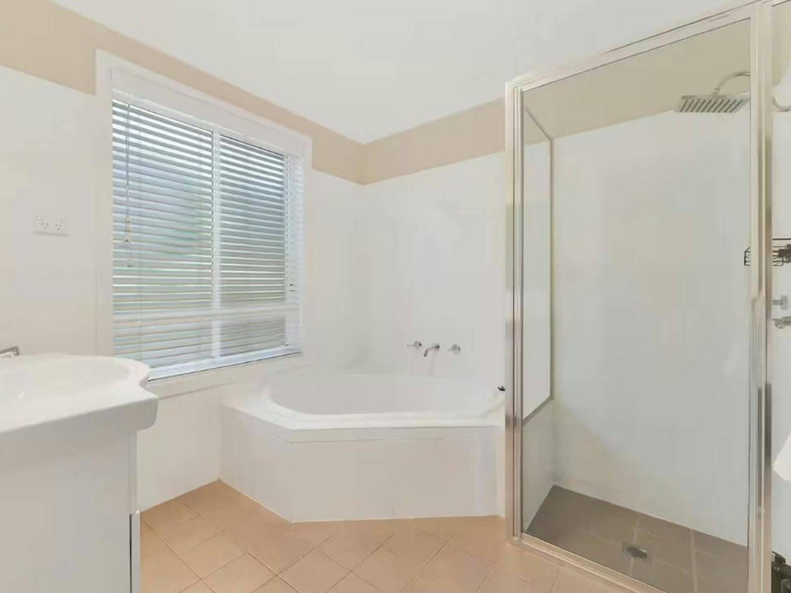 Bathroom with shower, large bath and vanity