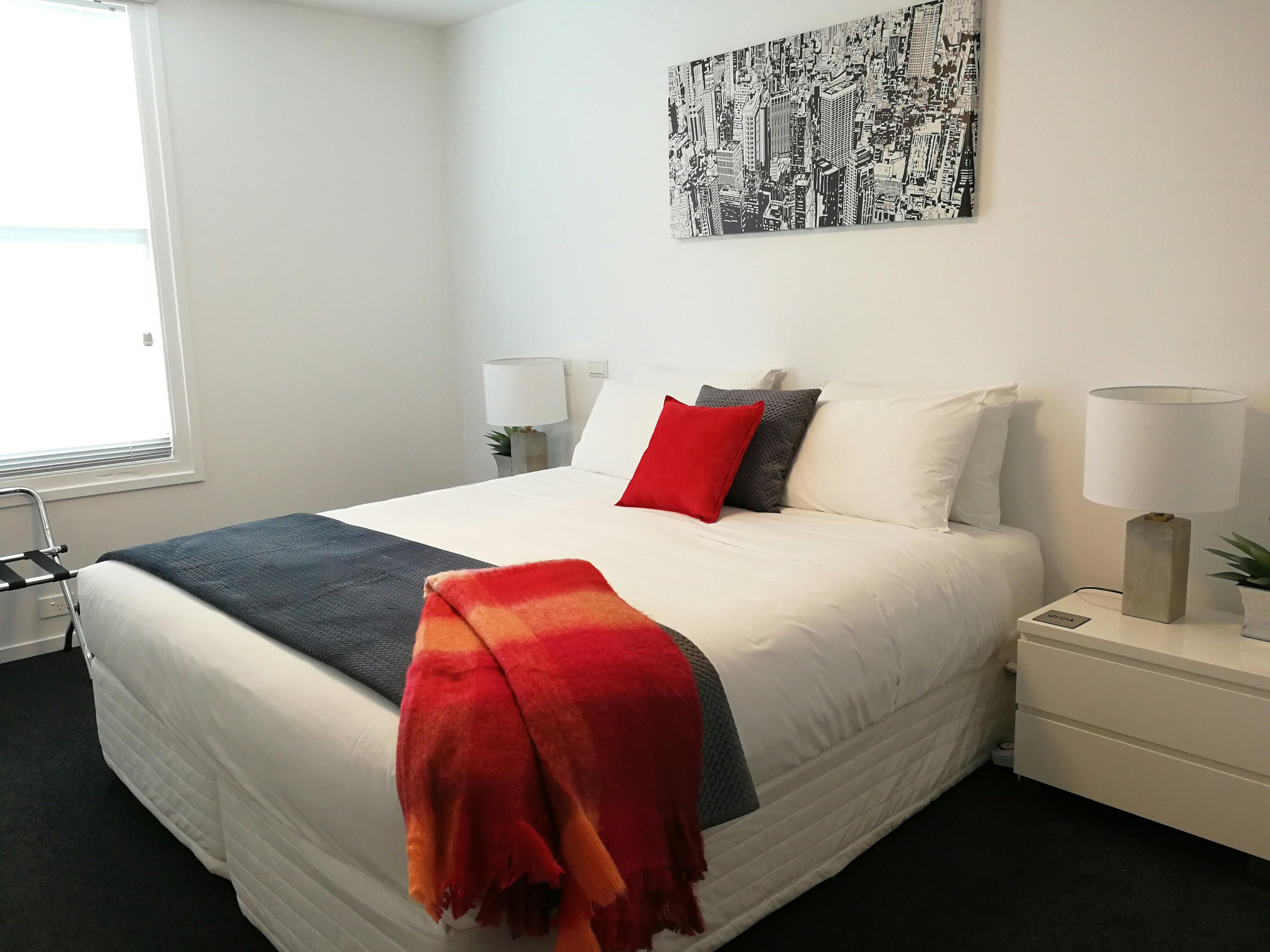 Main bedroom configuration: king bed (shown) or two single beds. Port-a-cot or rollaway can be added