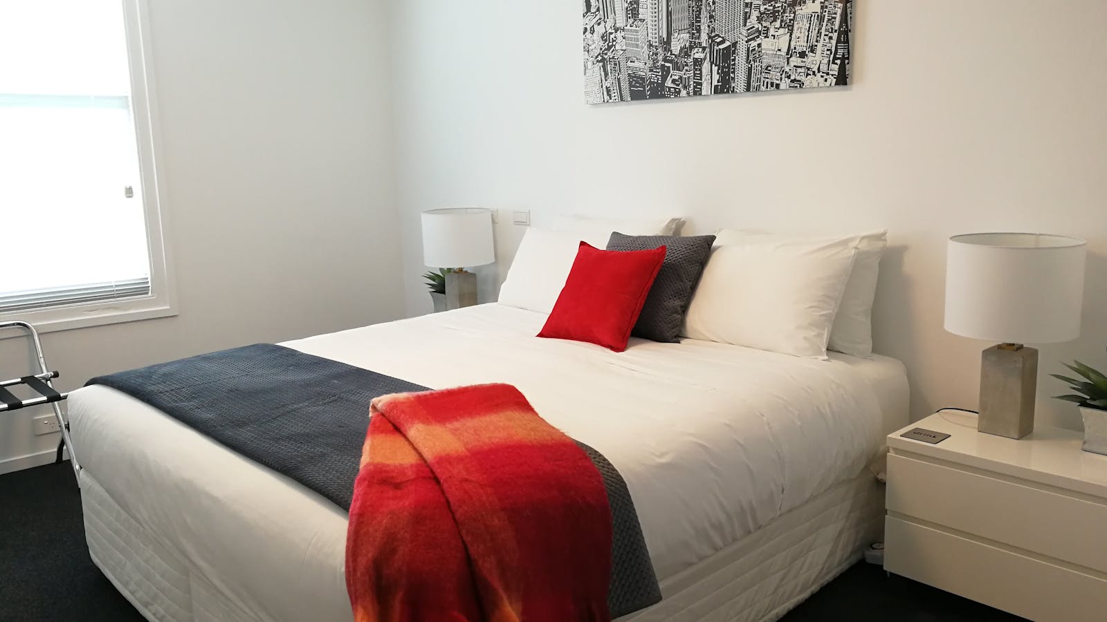 Main bedroom configuration: king bed (shown) or two single beds. Port-a-cot or rollaway can be added
