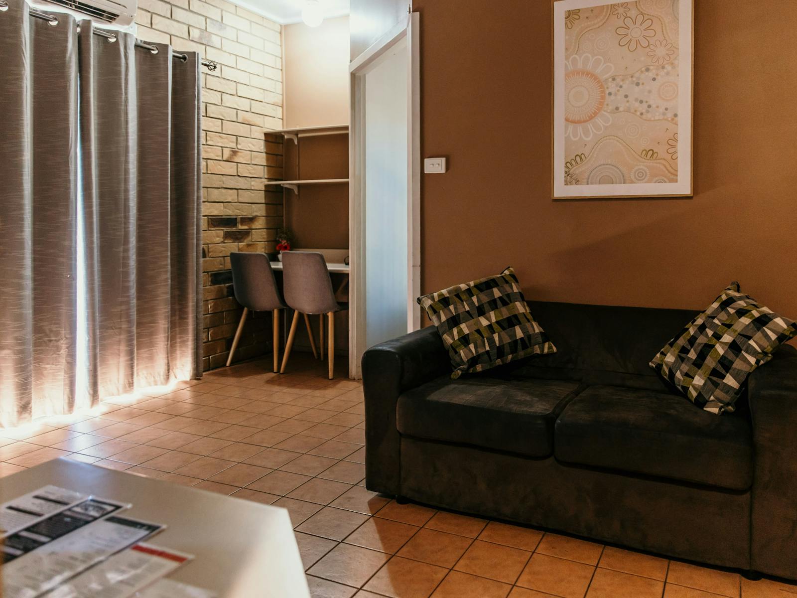 Lounge Room with sofa, desk and chairs.