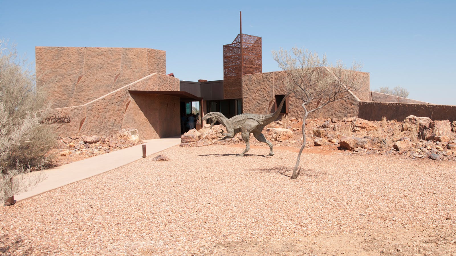 A visist to Australian Age of Dinosuars museum building with life sized dinosaur at entry