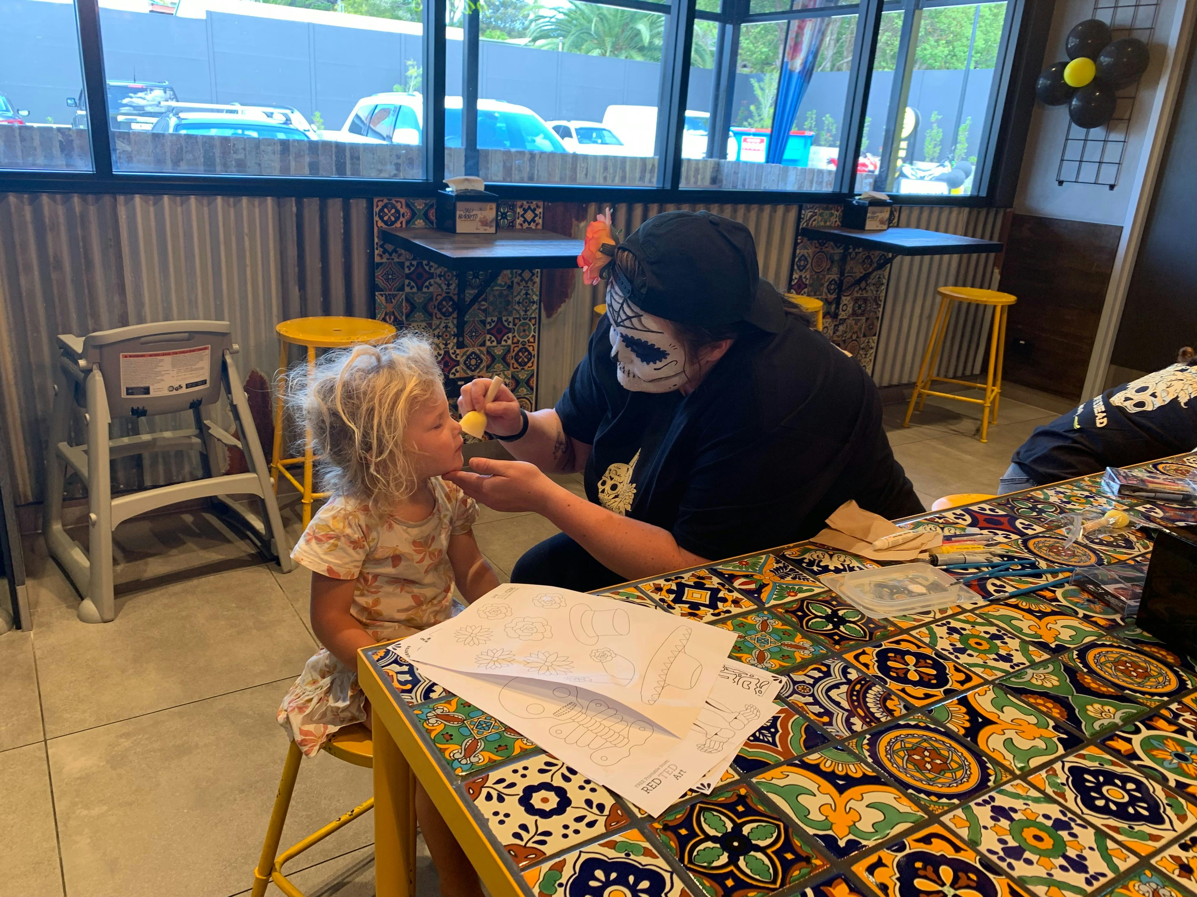 employees entertaining young customers