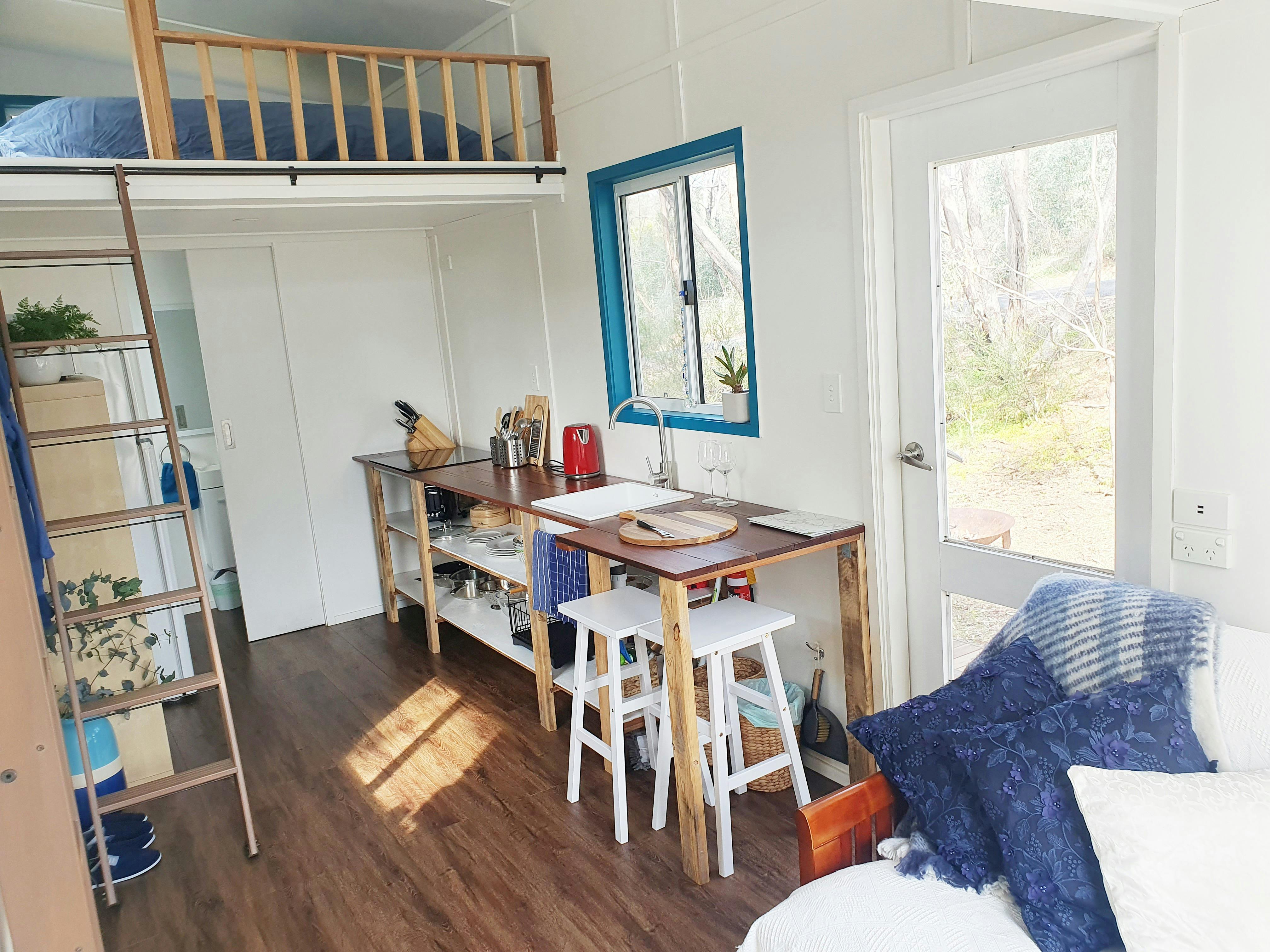 The interior of the Blue Orchid Tiny House is light filled and feels surprisingly spacious.