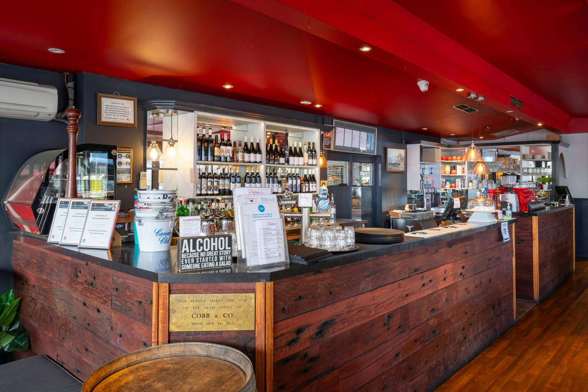 The first thing you see when you walk into Pantano's Bar & Grill is the large red timber bar.