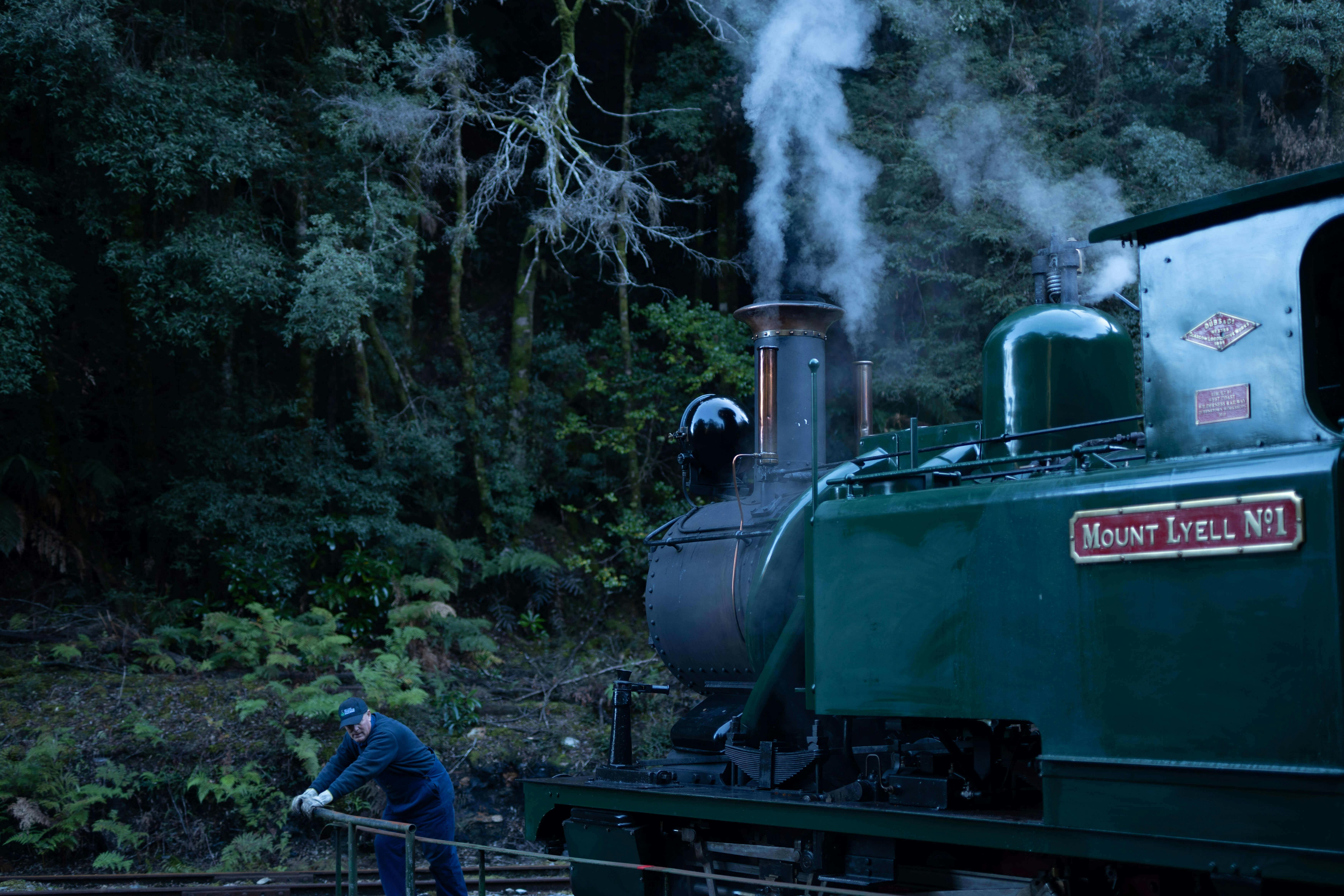 Locomotive crew push the manual turntable to turn the locomotive when its time to head home