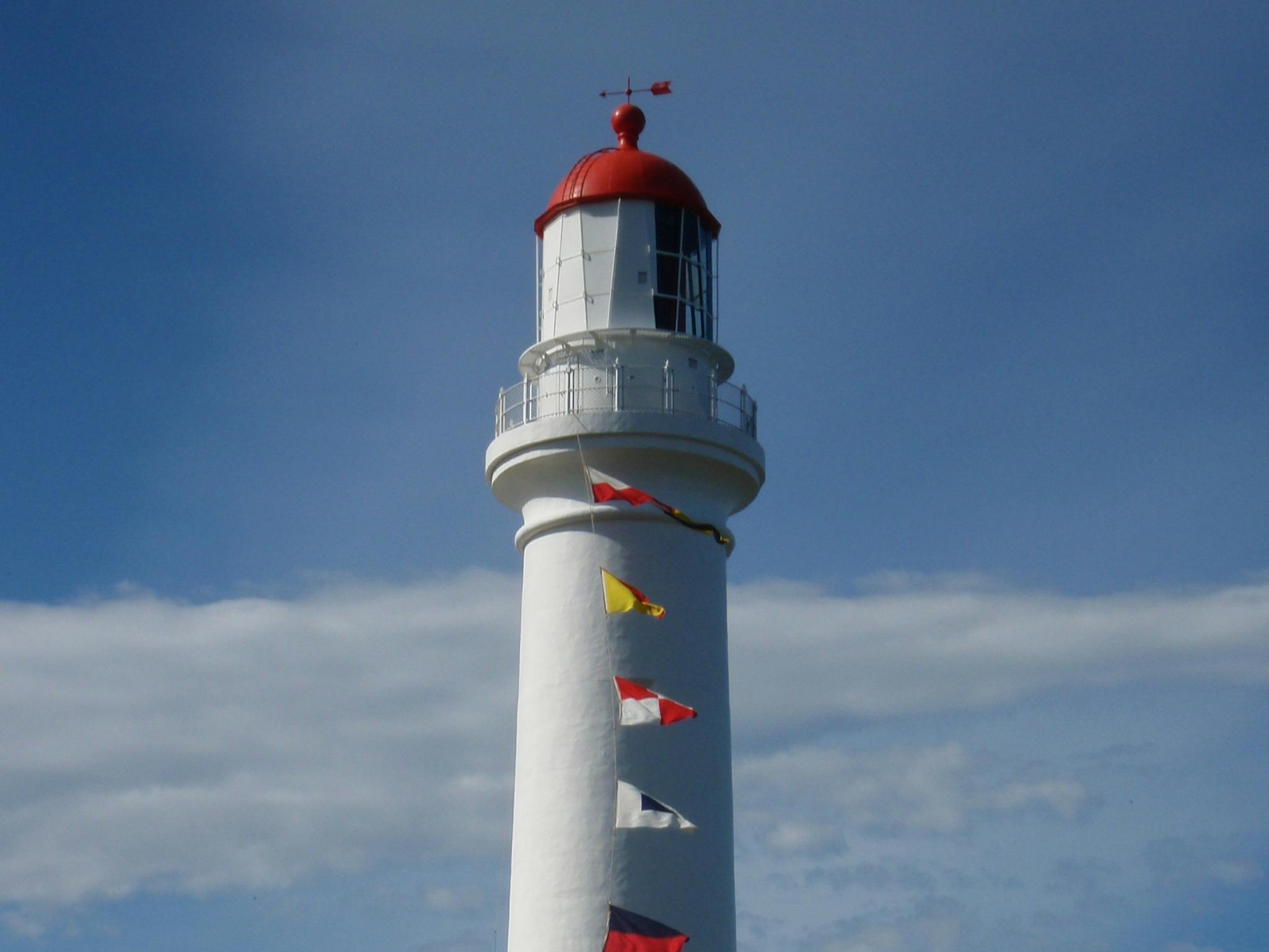 A full view of Split Point Lightouse on International Lighthouse Weekend with signal flags flying