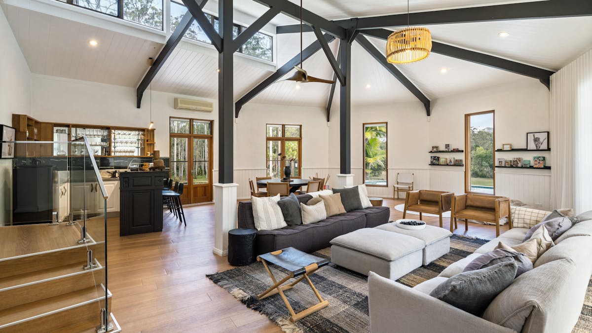 A large tranquil living space equipped with a bar.