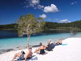 Tour guests relaxing on Fraser Island lake